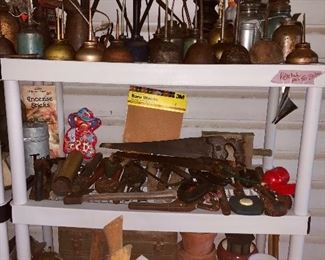 Back porch; lot of oil cans, tools, the wood handles you see are axes. 