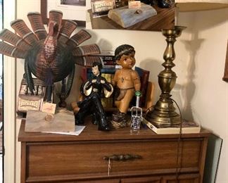 Large wood caved turkey by Richard Morgan, Asian girl, Indian boy, vintage "Buckaroo Bank" slot machine bank and a heavy brass lamp.