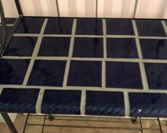 #10)   $50 - Iron Bakers Rack with Tile Shelf.    Dimensions not available.  