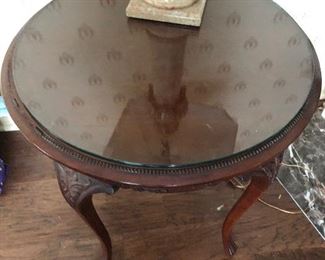 #4)  $50 - Solid wood carved round table with glass top.  26" diameter x 30" tall.  