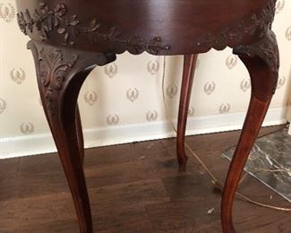 #4)  $50 - Solid wood carved round table with glass top.  26" diameter x 30" tall.  