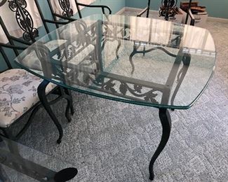 #15)  9 Piece Iron and Glass Furniture Set.  $700 for the set.  Individually Lamp table $125, Coffee Table $150, Sofa Table $175, Bakers Rack $225, Dining Table with 4 Chairs $400.  Bakers rack is 36 " W x 19" D x 75" H, Coffee Table is 50"W x 24" D x 16" H, Lamp Table is 28" W x 24" D, x 24" H, Sofa Table is 54" W x 18 " D x 29" H, Breakfast Table is 42" W x 42" D x 30 " H.  