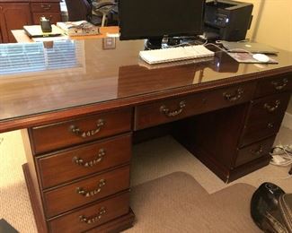 #24)  $300 - Solid cherry Executive Desk with Glass Top.  