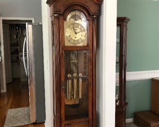#1 $950 - Howard Miller Grandfather Clock 59th Anniversary Limited Edition. In perfect working order. 4 strike tones/options. With key for cabinet. 20" W (22"at base) x 12" D (14" at base) x 84" H.