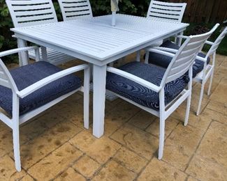 #2) $500 -  White aluminum outdoor patio table with 6 chairs, umbrella, umbrella stand and 6 matching chair cushions.  In excellent condition.  Cushions show some wear.  