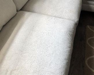 #35) $200 - Sectional sofa with pillows.  Off-white fabric shows wear.  Structurally in good condition.  Smoke Free home.  