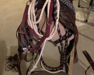 #36)  $350 -  1940's Carved Leather Saddle by Monroe Saddle Company with accessories.  #40 Oklahoma Roper.  Comes with 2 blankets, a bridal headstall, a couple of cinches, ropes, reigns and other assorted leather accessories.  