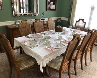 #28)  $600 Stanley brand pecan dining table with 8 chairs. (2 captain chairs and 6 side chairs).  Chairs are wicker back with upholstered seats.  In Excellent condition.  Well cared for furniture.  Matching Stanley pecan 2 piece hutch sold separately.  