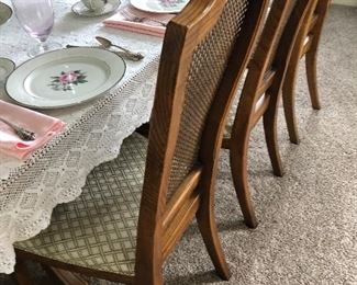 #28)  $600 Stanley brand pecan dining table with 8 chairs. (2 captain chairs and 6 side chairs).  Chairs are wicker back with upholstered seats.  In Excellent condition.  Well cared for furniture.  Matching Stanley pecan 2 piece hutch sold separately.  