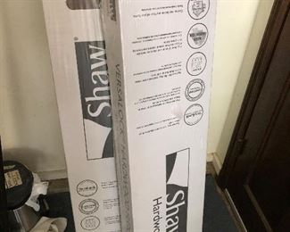 #38)  $50 - 2 Boxes Shaw hard wood flooring.  Dark Brown.  