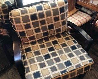 #47)  $50 - Wooden arm chair with pillow seats and back.  