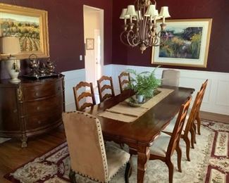 Dining table, rug, and six side chairs only.  Buffet, silver set, and art work not available.