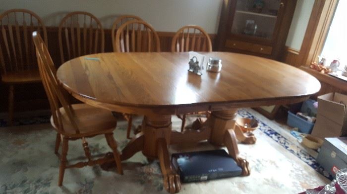 1. beautiful oak dining room table and 6 chairs. it has 2 leaves only one is in it now. $200
