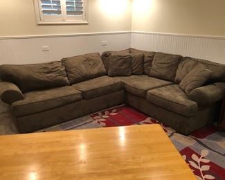 Upholstered sectional sleeper sofa. Sleeper section 71”wide. Right L-shape measures 36” x  88” 