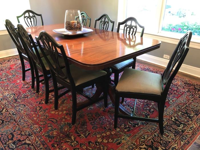 Gorgeous dining room table with 10 chairs! Shown with one 12” leaf but includes 2 additional 12” leafs! Table measures 42”deep x 66”wide with NO leaf! 