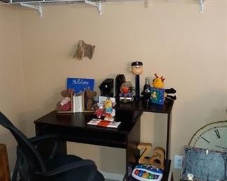 small desk with black chair, children's   books
