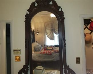 Marble Top Victorian Serpentine Front Dresser with Pierced Carved Yoke holding a Plate Glass Framed Mirror Attributed to one of the New Orleans Furniture Maker