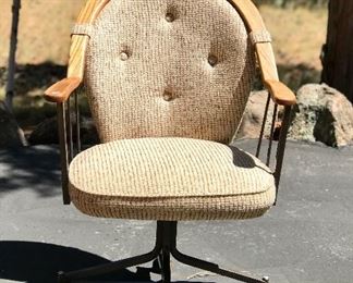 One of three vintage rolling chairs