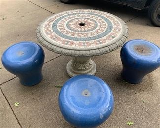 Solid concrete table with 4 upside down planters as seats