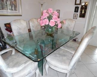 Glass Dining Table, heavy heavy glass top and base.           6 Fully upholstered chairs.