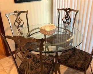 Exceptional Chippendale chairs in brushed steel from White House. 