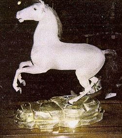 A CONTINENTAL STUFFED FIGURE OF A REARING STALLION, LATE 19TH/20TH CENTURY
Covered in horse hide and hair mane and tail, on rockery giltwood base
15 in. high; 5 1/2 in. wide; 16 in. deep (approximately)                                                     Appraised Value: $500.00