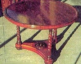 SOLD - A ROSEWOOD CIRCULAR CENTER TABLE
MID-19TH CENTURY
With later French-polished surface, the three barley- twist legs on a concave triangular base with center rosette bun feet
27 in. high; 39 in. diameter                            Appraised Value:  $3000.00