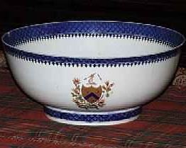 A CHINESE EXPORT ARMORIAL BLUE AND WHITE PORCELAIN PUNCH BOWL, CIRCA 1790
With underglaze blue border, the enameled and gilt- crested armorial emblem on each side opposed by colorful enameled floral splays on the other two sides and interior of bowl
5 in. high; 12 in. diameter
PROVENANCE: Christie's New York             Appraised Value: $1500.00