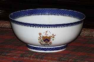 A CHINESE EXPORT ARMORIAL BLUE AND WHITE PORCELAIN PUNCH BOWL, CIRCA 1790
With underglaze blue border, the enameled and gilt- crested armorial emblem on each side opposed by colorful enameled floral splays on the other two sides and interior of bowl
5 in. high; 12 in. diameter
PROVENANCE: Christie's New York             Appraised Value: $1500.00