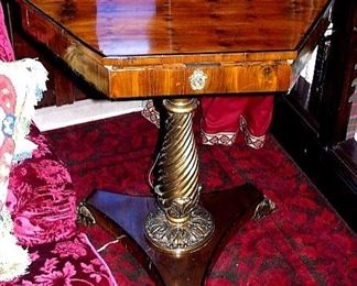 SOLD - A CONTINENTAL PARCEL-GILT AND EBONIZED YEWWOOD OCCASIONAL TABLE
LATE 19TH CENTURY
The hexagonal top above a fitted frieze drawer, on spiral- fluted baluster stem with foliate and tripartite base, on stylized paw feet
32 in. high; 29 in. wide; 29 in. deep              Appraised Value: $3000.00