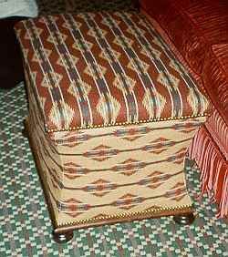 SOLD -  A VICTORIAN STYLE OTTOMAN 20TH CENTURY
The rectangular hinged cover above a concave rectangular body, on flattened bun feet
19 in. high; 27 in. wide; 19 in. deep                                       Price $400