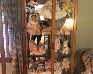 Curio cabinet and antique dolls 