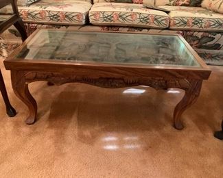 #3	Heavily Carved (Village w/people, animals) Coffee table w/glass protect   36x18x16	$175 

