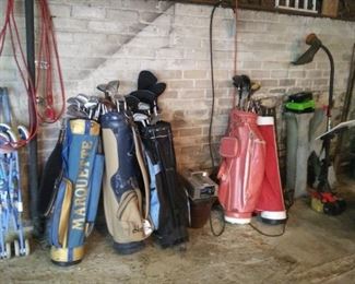 Assorted golf clubs