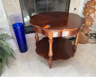 $165=scalloped wood table