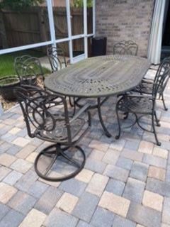 $350 aluminium oval table with six chairs