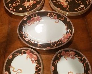 Wedgwood dinner service. Black with dragon detail