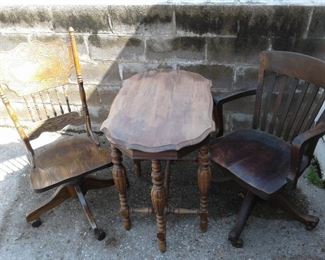 2 Vintage Roller Desk Chairs on Coasters and Wood Table