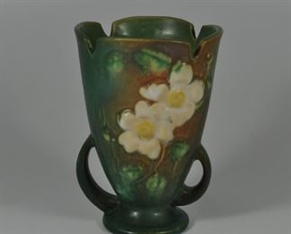 Roseville vase in White Rose pattern. 6 1/4" x 3 1/2". Very good condition.  $54