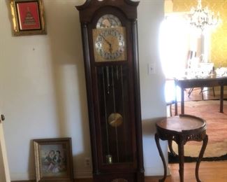 Grandfather Clock, walnut, circa 1930, time, strike & chime (3 weights) Moon calendar. Doesn't work. $250.
