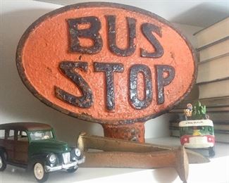 Bus stop sign has sold but cars still available.