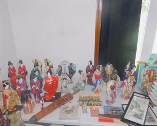 Asian dolls and mud men and decor