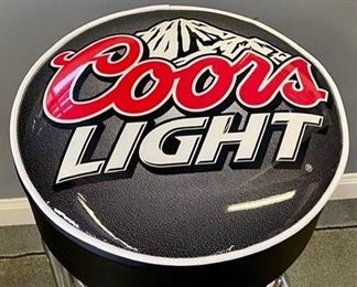 Lot 959.  $45.00 as is..1 Coors Light Bar Stool.  31" T and 15" Diameter. $40.00. Has a 2 inch slit as can be seen the photos.  Cute bar stool, though!