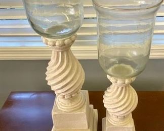 Lot 958.  $30.00  2 Sand Color Decor with Glass Vase Candle Holders.  18"T x 4.5" W  22" T x 6" W. $38 for the pair