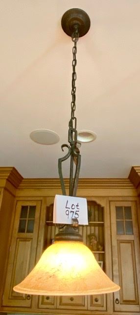 Lot 975.  Lot 975 $435.00. 3 Pendant Lights in Kitchen with Wrought Iron Base by Fine Arts.