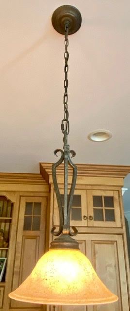 Lot 975.  Lot 975 $435.00. 3 Pendant Lights in Kitchen with Wrought Iron Base by Fine Arts.