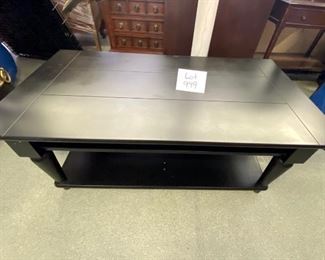 Lot 999  Buy it Now $95.00  Black Stained Wood Coffee Table with Shelf on Bottom and below Top for Magazines or Books	40" L x20" D x 18" T. Missing a divider on bottom shelf