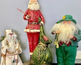 Lot 1061. Buy it Now $25.00  Set of 3 Santas Lot includes tall red resin Santa with sack of gifts, Shamrock Santa, and Rustic string beard Santa tree topper.	Size: 24.5", 16.5", and 12.5"