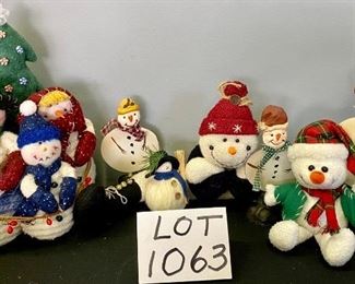 Lot 1063.Buy it Now $36.00  Multiple Snowmen Lot. 7 pieces. Lot includes small draft dodger Snowman, stuffed caroling Santa trio with a tree, small plush snowman with tartan hat and scarf, mini straw broom ball snowman, and set of 3 metal snowmen with booted feet.	Sizes 3" to 12"