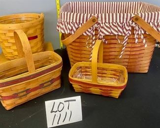 Lot 1111. Buy it Now $72.00  4 Longaberger basket assortment.  1990 handled basket with red ticking liner, 1994 med curved handle basket, 1998 small curved handle basket, 1998 round Dresden tour basket. Lg 1990 16x13x11, 1994  basket 9x5x5, 1998 basket 8x5x3, Dresden tour 8' round 6.5" tall,  